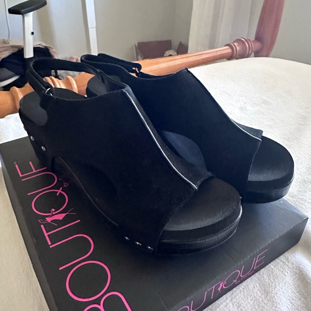 Brand new Boutique black wedge heels never worn
